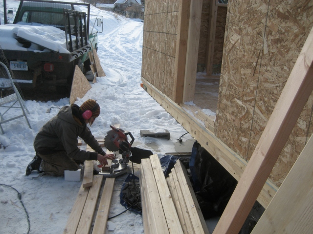 Laura cutting rafters.  This project is so small we're continually moving on to the next task.
